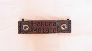 Handcrafted African Wall Art – “Hakuna Matata” Wooden Sign with Beadwork